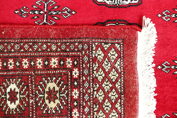 Red Pakistani Bokhara Rug 4' 5" x 6' 3" Hand-Knotted | No. QA56380