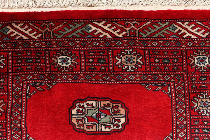 Red Pakistani Bokhara Rug 2' 6" x 10' 3" Hand-Knotted | No. QA56773