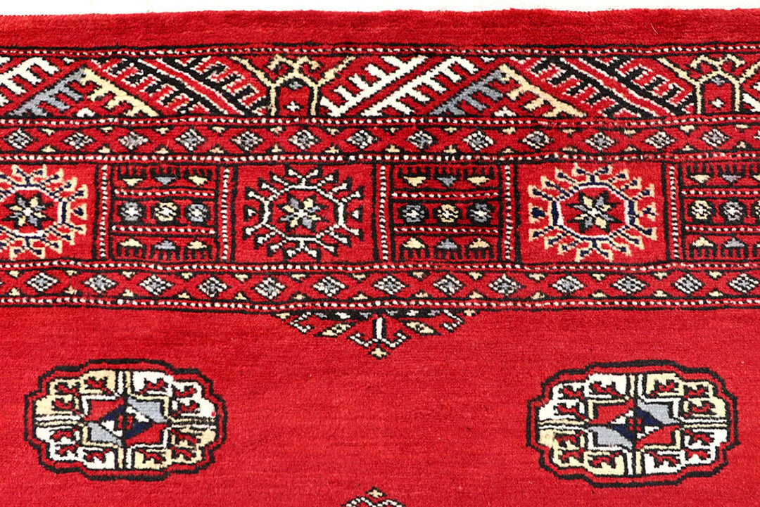 Red Pakistani Bokhara Rug 4' x 6'1" Hand-Knotted | No. QA57233
