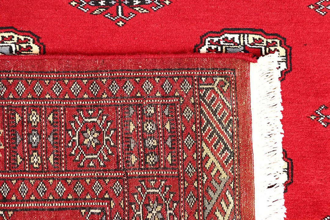 Red Pakistani Bokhara Rug 4' x 6'1" Hand-Knotted | No. QA57233