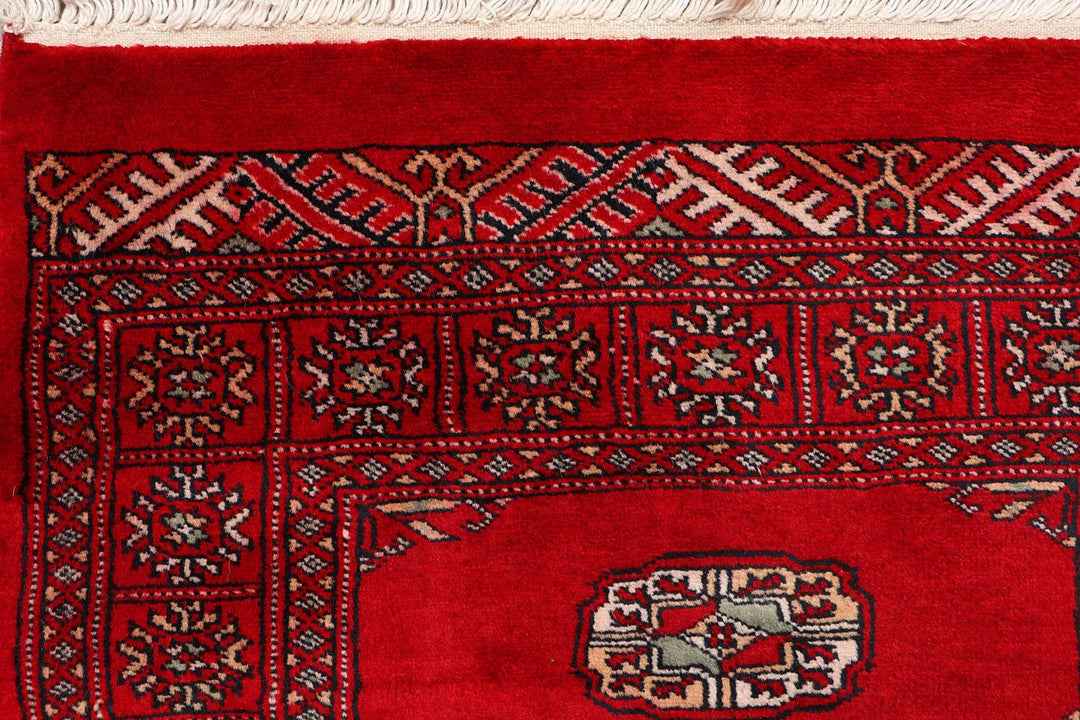 Red Pakistani Bokhara Rug 2' 6" x 9' 8" Hand-Knotted | No. QA57770