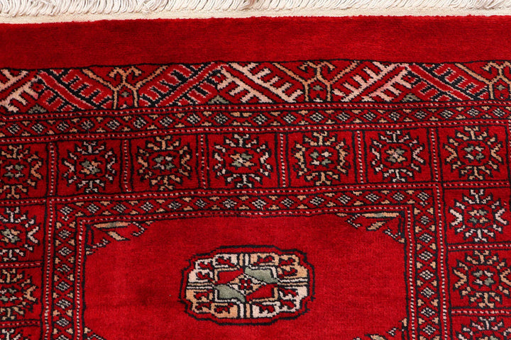 Red Pakistani Bokhara Rug 2' 6" x 9' 8" Hand-Knotted | No. QA57770