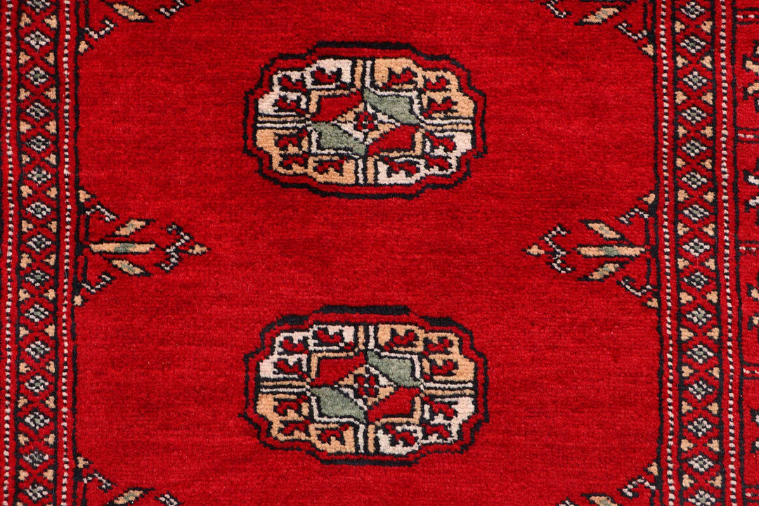 Red Pakistani Bokhara Rug 2' 6" x 9' 8" Hand-Knotted | No. QA57770