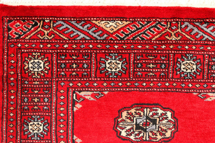 Red Pakistani Bokhara Rug 2' 6" x 8' 9" Hand-Knotted | No. QA57822