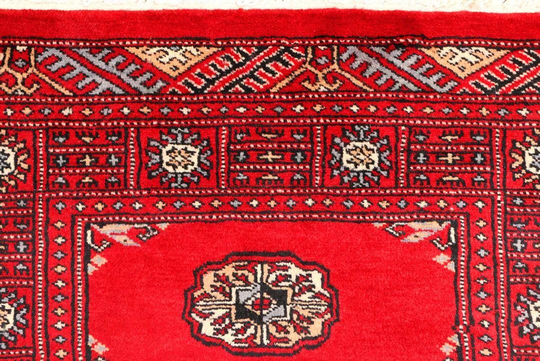 Red Pakistani Bokhara Rug 2' 6" x 8' 9" Hand-Knotted | No. QA57822