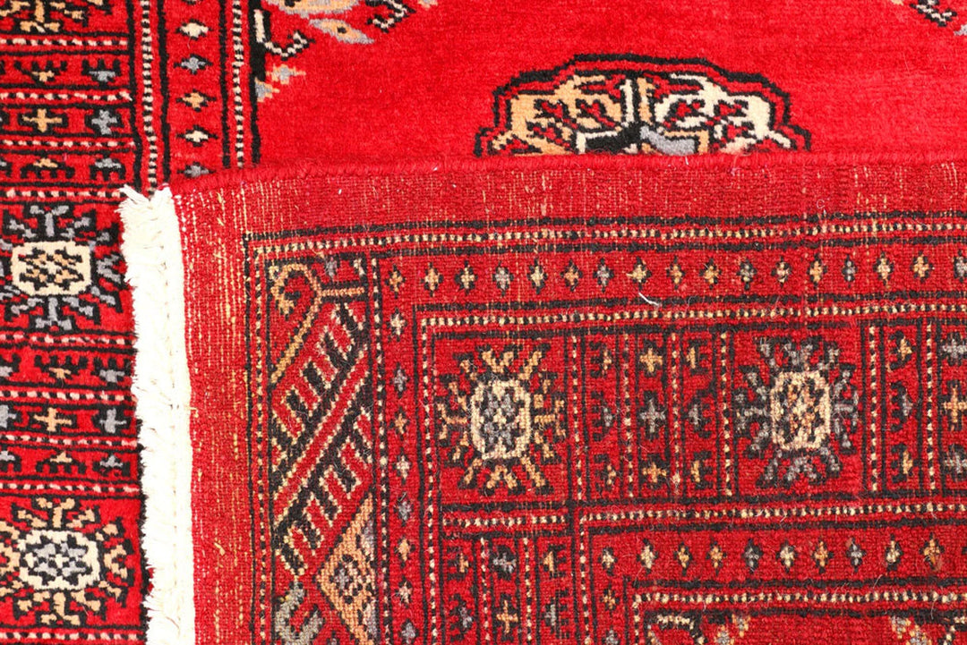 Red Pakistani Bokhara Rug 2' 6" x 8' 9" Hand-Knotted | No. QA57822