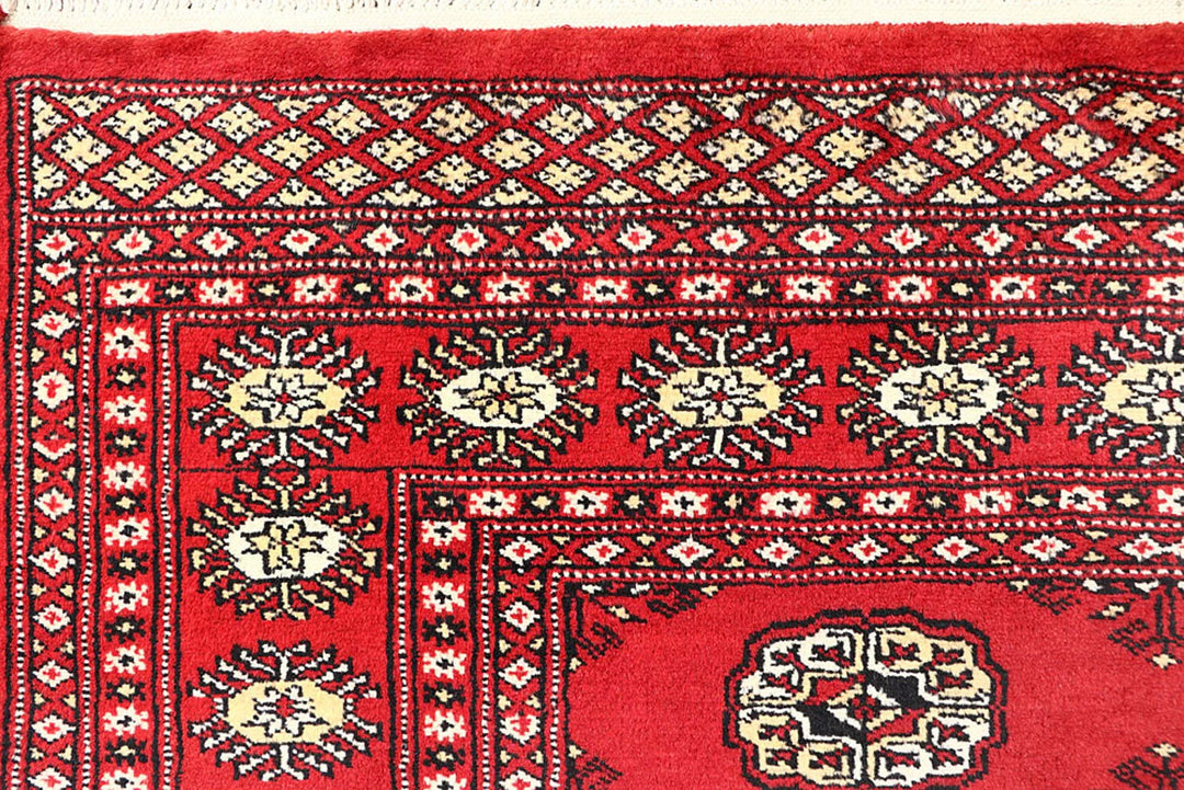 Red Pakistani Bokhara Rug 4' 1" x 6' 1" Hand-Knotted | No. QA57842