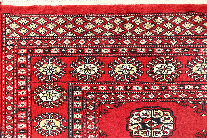 Red Pakistani Bokhara Rug 4' 1" x 6' 1" Hand-Knotted | No. QA57842