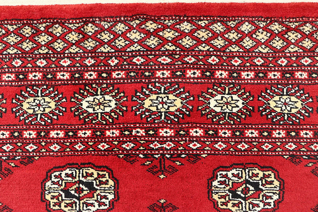 Red Pakistani Bokhara Rug 4' 1" x 6' 1" Hand-Knotted | No. QA57842