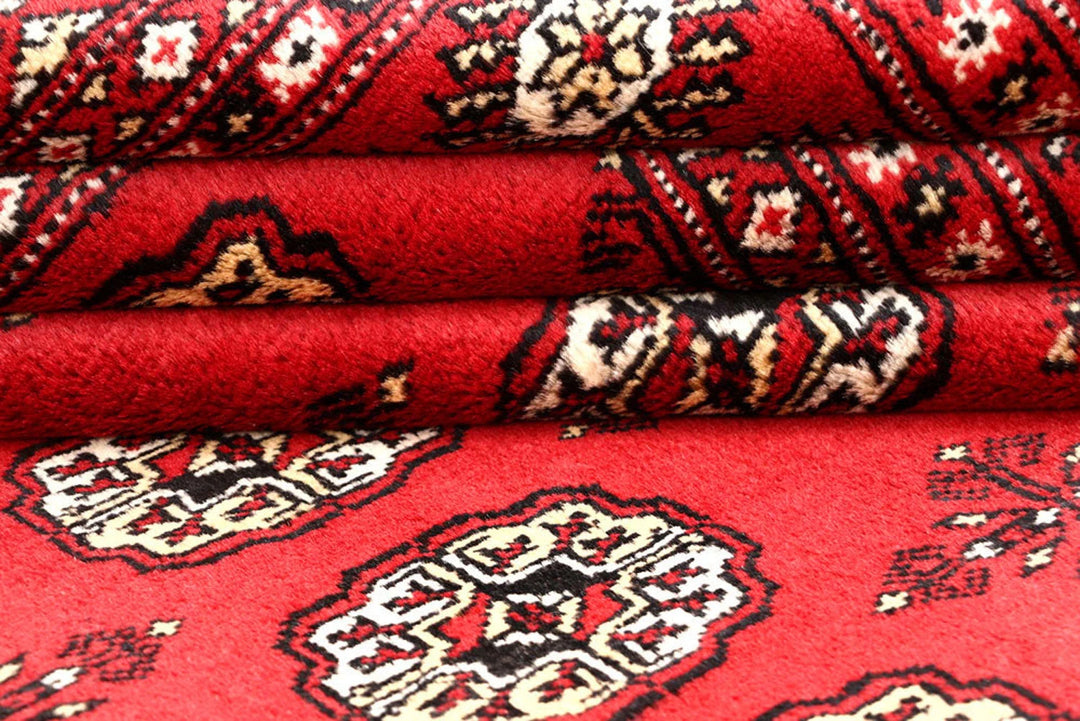 Red Pakistani Bokhara Rug 4' 1" x 6' 1" Hand-Knotted | No. QA57842