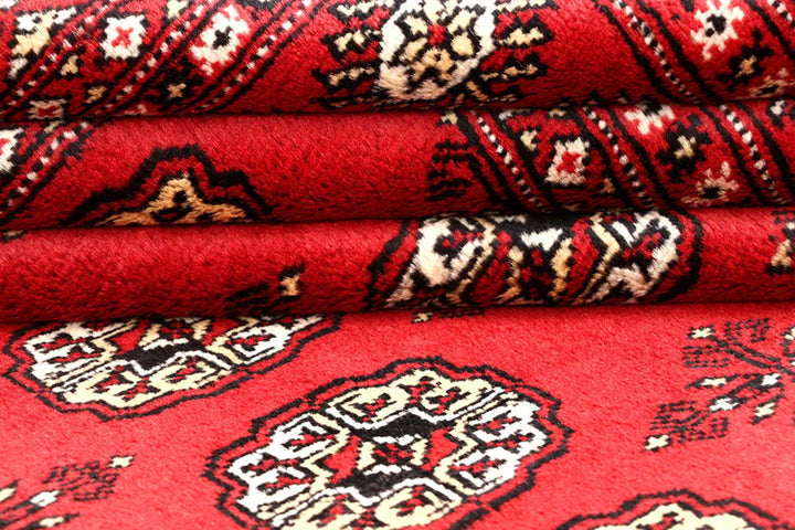Red Pakistani Bokhara Rug 4' 1" x 6' 1" Hand-Knotted | No. QA57842