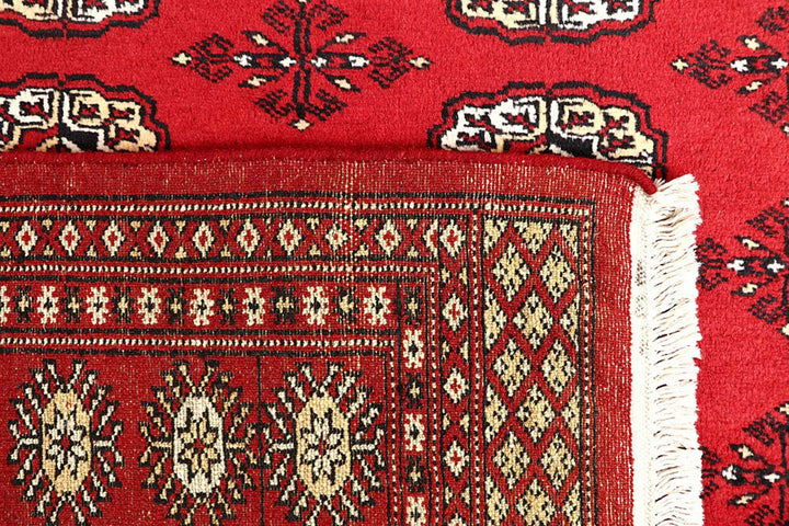 Red Pakistani Bokhara Rug 4' 1" x 6' 1" Hand-Knotted | No. QA57842