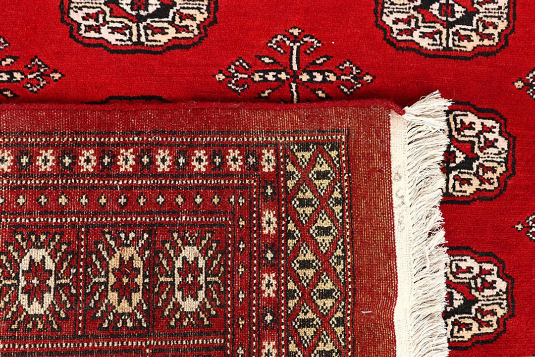 Red Pakistani Bokhara Rug 6' x 9'2" Hand-Knotted | No. QA58108