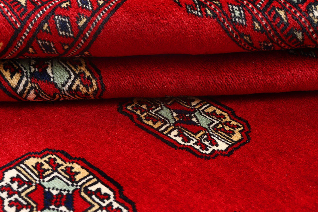 Firebrick Red Pakistani Bokhara Rug 4' 1" x 5' 4" Hand-Knotted | No. QA58926