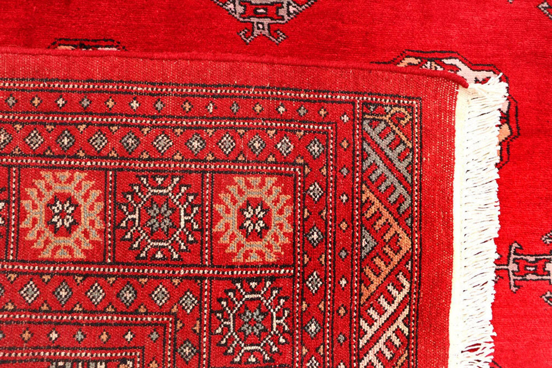 Red Pakistani Bokhara Rug 4' 6" x 7' 3" Hand-Knotted | No. QA59015