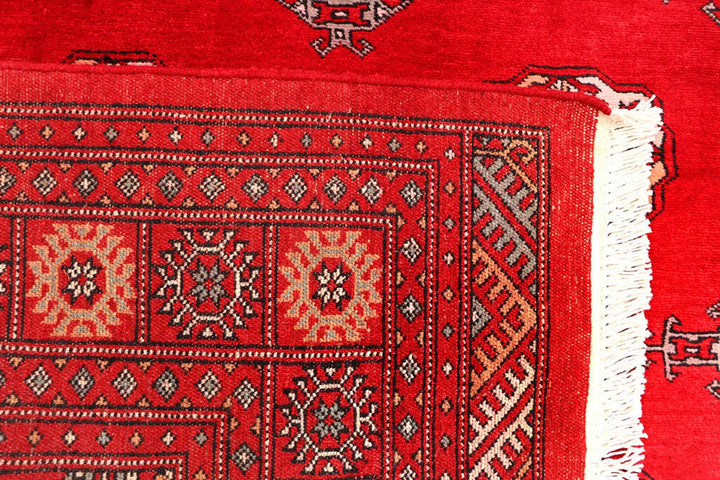 Red Pakistani Bokhara Rug 4' 6" x 7' 3" Hand-Knotted | No. QA59015