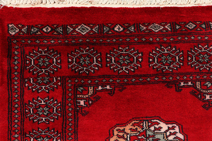 Red Pakistani Bokhara Rug 2' 6" x 9' 11" Hand-Knotted | No. QA59464