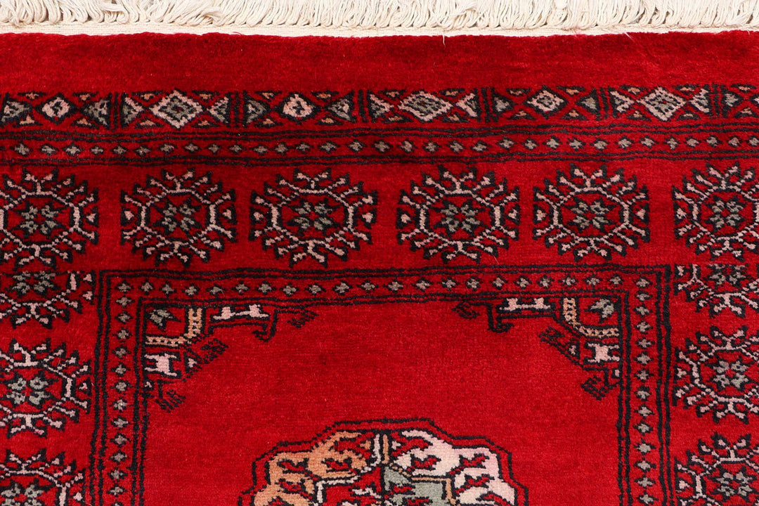 Red Pakistani Bokhara Rug 2' 6" x 9' 11" Hand-Knotted | No. QA59464