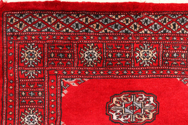 Red Pakistani Bokhara Rug 2' 7" x 8' 11" Hand-Knotted | No. QA59573