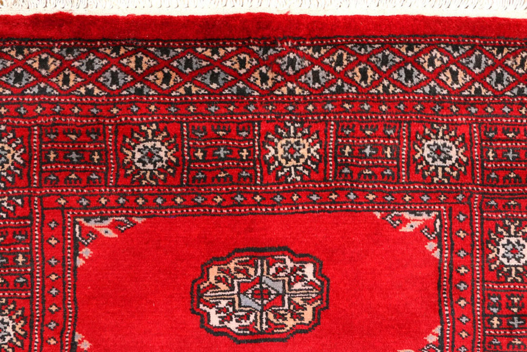 Red Pakistani Bokhara Rug 2' 7" x 8' 11" Hand-Knotted | No. QA59573