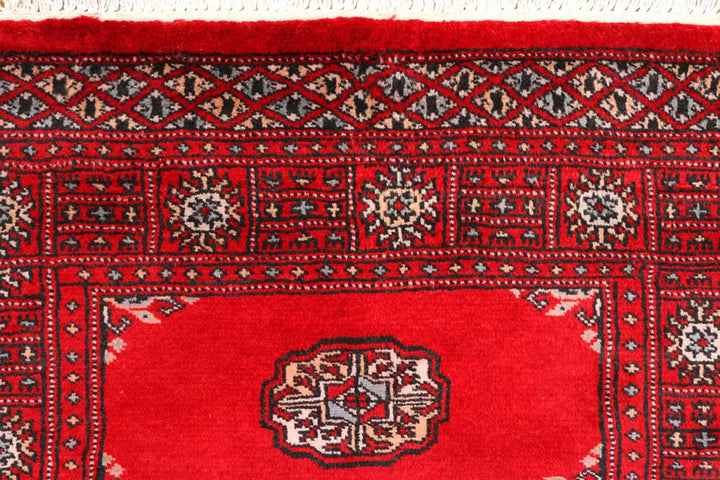 Red Pakistani Bokhara Rug 2' 7" x 8' 11" Hand-Knotted | No. QA59573