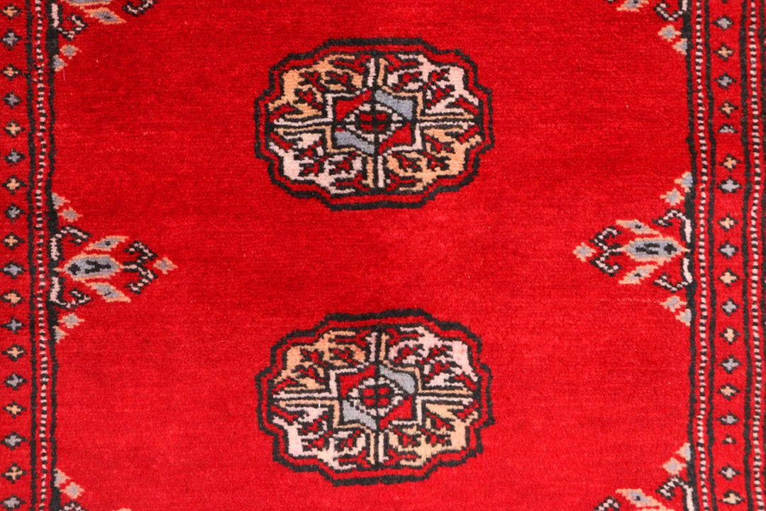 Red Pakistani Bokhara Rug 2' 7" x 8' 11" Hand-Knotted | No. QA59573