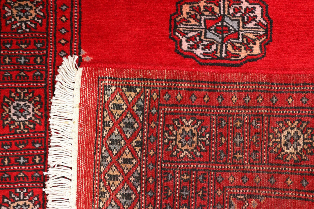 Red Pakistani Bokhara Rug 2' 7" x 8' 11" Hand-Knotted | No. QA59573