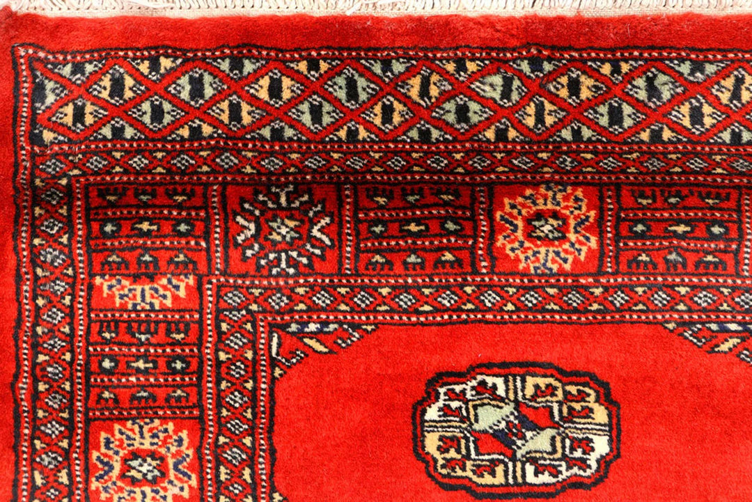 Red Pakistani Bokhara Rug 2' 7" x 12' Hand-Knotted | No. QA59649