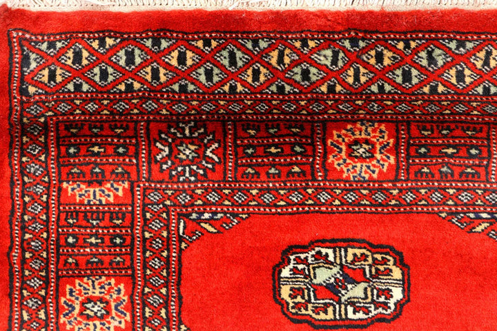 Red Pakistani Bokhara Rug 2' 7" x 12' Hand-Knotted | No. QA59649