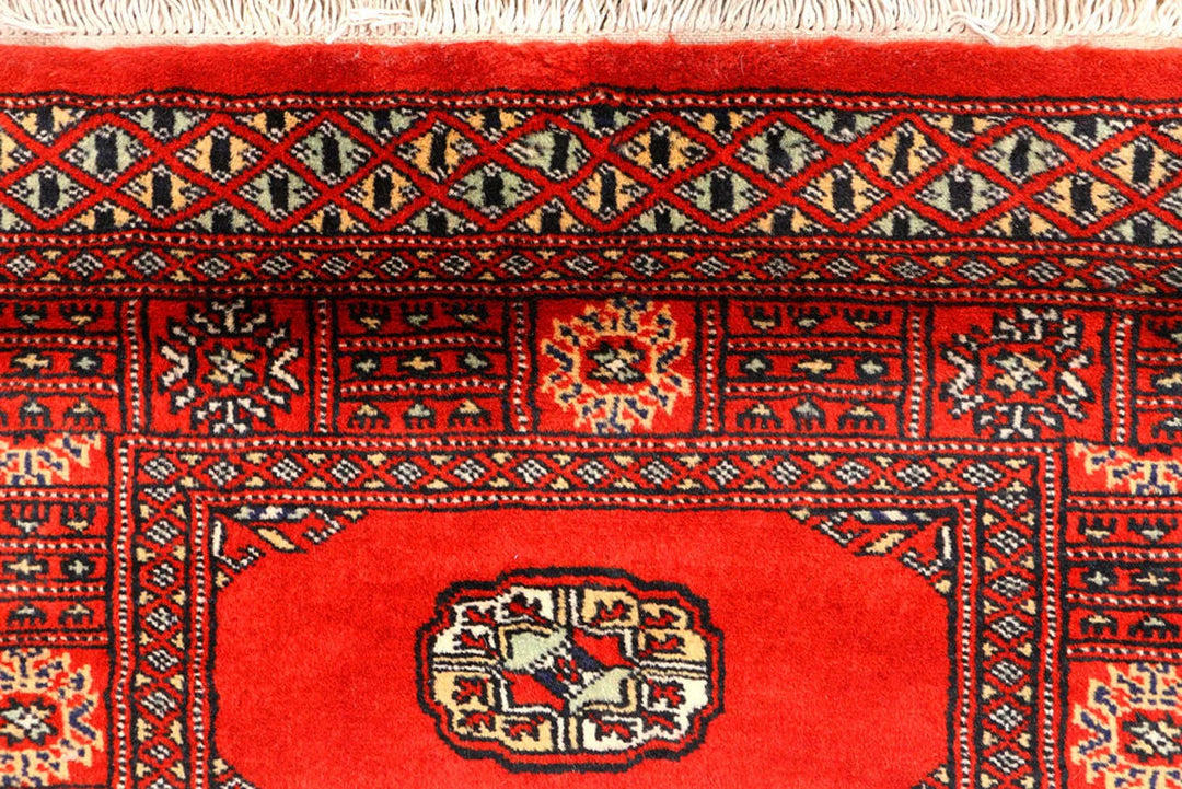 Red Pakistani Bokhara Rug 2' 7" x 12' Hand-Knotted | No. QA59649