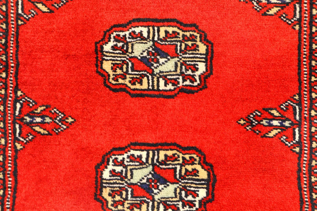 Red Pakistani Bokhara Rug 2' 7" x 12' Hand-Knotted | No. QA59649