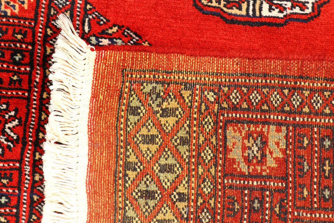 Red Pakistani Bokhara Rug 2' 7" x 12' Hand-Knotted | No. QA59649