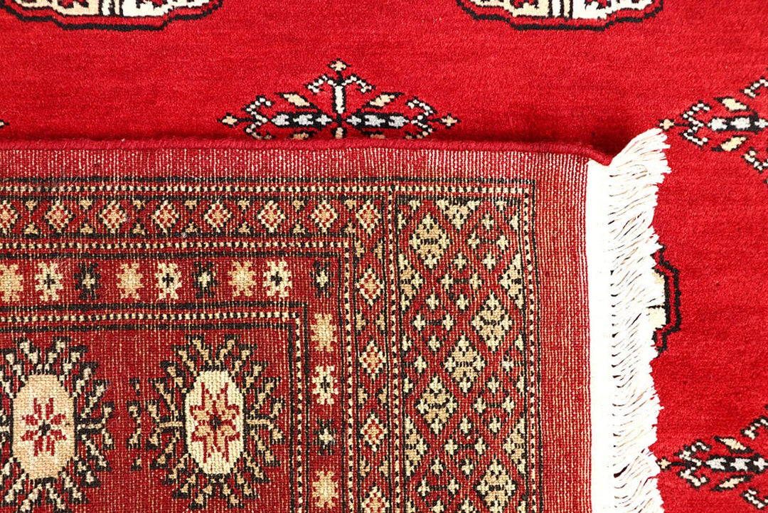 Red Pakistani Bokhara Rug 4' 2" x 6' 6" Hand-Knotted | No. QA61172