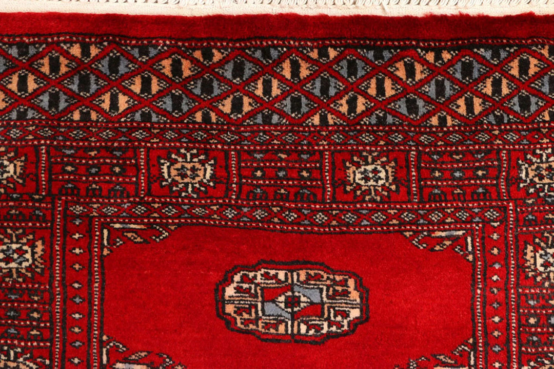 Red Pakistani Bokhara Rug 2' 7" x 9' 3" Hand-Knotted | No. QA61441
