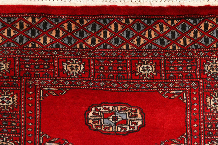 Red Pakistani Bokhara Rug 2' 7" x 9' 3" Hand-Knotted | No. QA61441