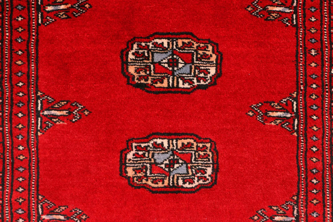 Red Pakistani Bokhara Rug 2' 7" x 9' 3" Hand-Knotted | No. QA61441