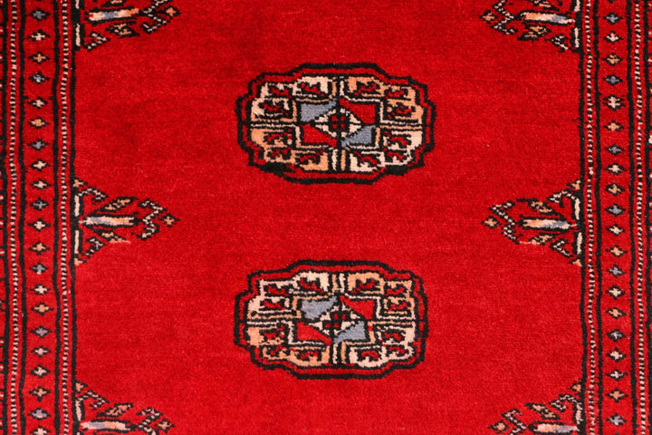 Red Pakistani Bokhara Rug 2' 7" x 9' 3" Hand-Knotted | No. QA61441