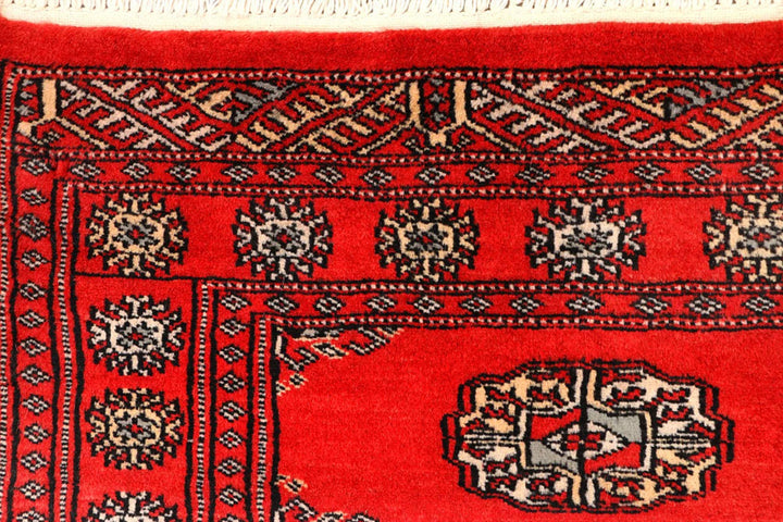 Red Pakistani Bokhara Rug 2' 6" x 10' Hand-Knotted | No. QA61485