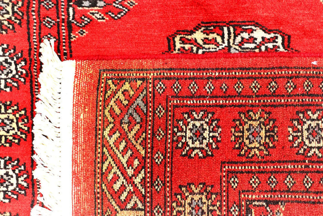 Red Pakistani Bokhara Rug 2' 6" x 10' Hand-Knotted | No. QA61485