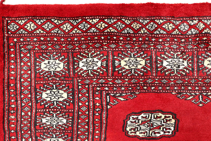 Red Pakistani Bokhara Rug 4' 2" x 6' 5" Hand-Knotted | No. QA61648
