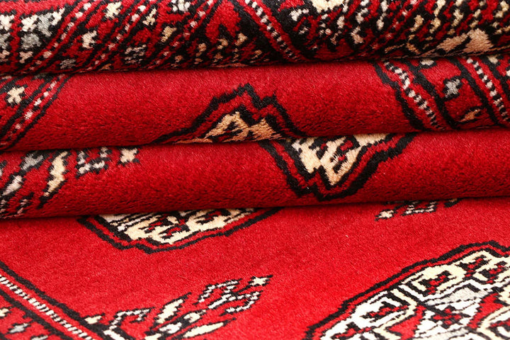 Red Pakistani Bokhara Rug 4' 2" x 6' 5" Hand-Knotted | No. QA61648