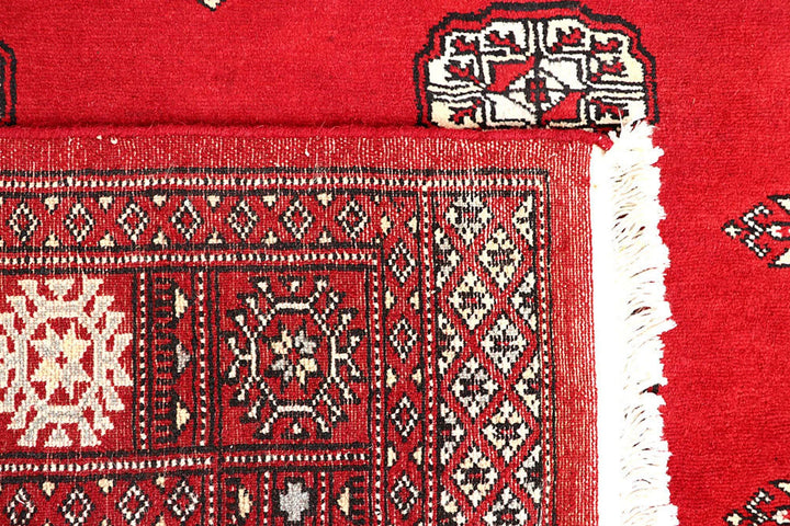 Red Pakistani Bokhara Rug 4' 1" x 6' 6" Hand-Knotted | No. QA62313
