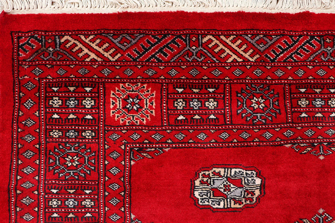 Red Pakistani Bokhara Rug 4' 2" x 6' 8" Hand-Knotted | No. QA63971
