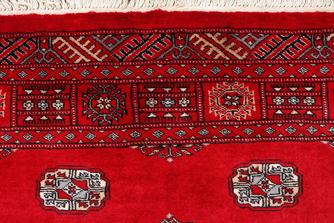 Red Pakistani Bokhara Rug 4' 2" x 6' 8" Hand-Knotted | No. QA63971