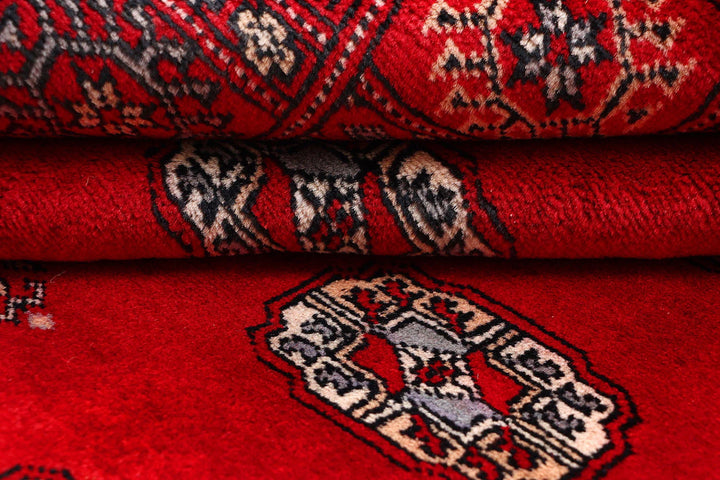 Red Pakistani Bokhara Rug 4' 2" x 6' 8" Hand-Knotted | No. QA63971