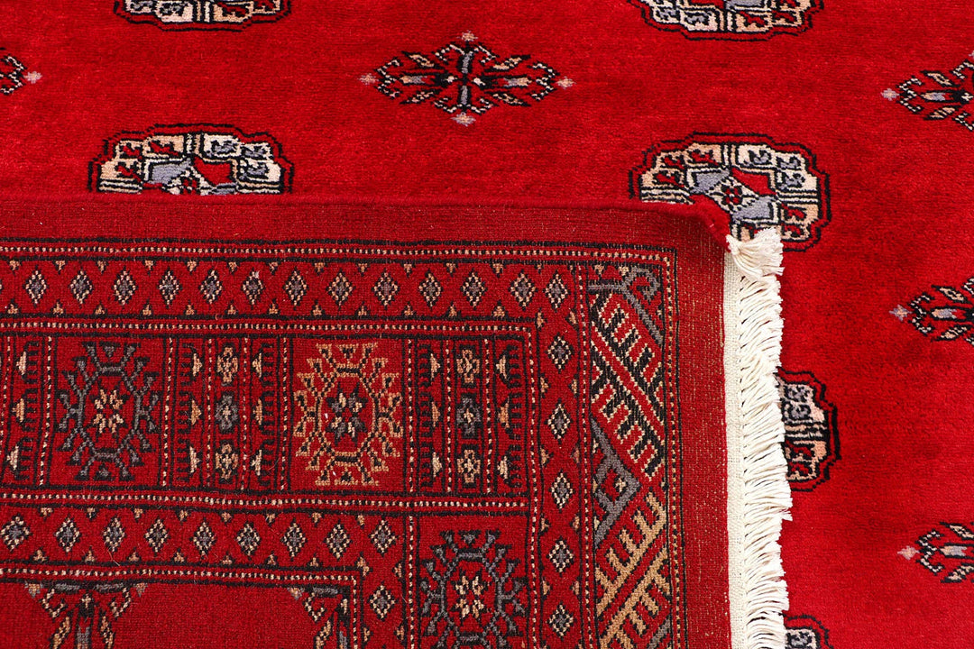 Red Pakistani Bokhara Rug 4' 2" x 6' 8" Hand-Knotted | No. QA63971
