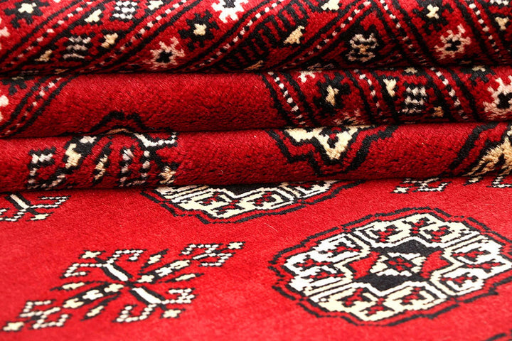 Red Pakistani Bokhara Rug 6' x 8'6" Hand-Knotted | No. QA66415