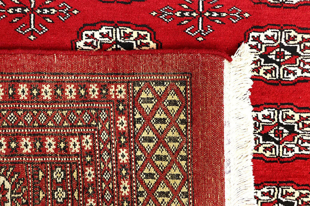 Red Pakistani Bokhara Rug 6' x 8'6" Hand-Knotted | No. QA66415