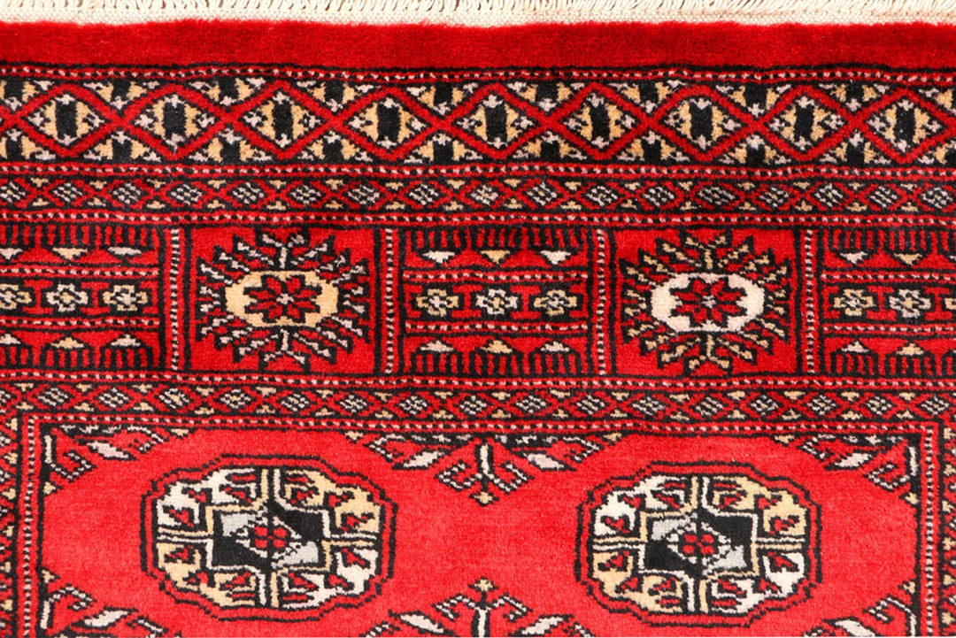 Red Pakistani Bokhara Rug 3' 1" x 5' 2" Hand-Knotted | No. QA66696