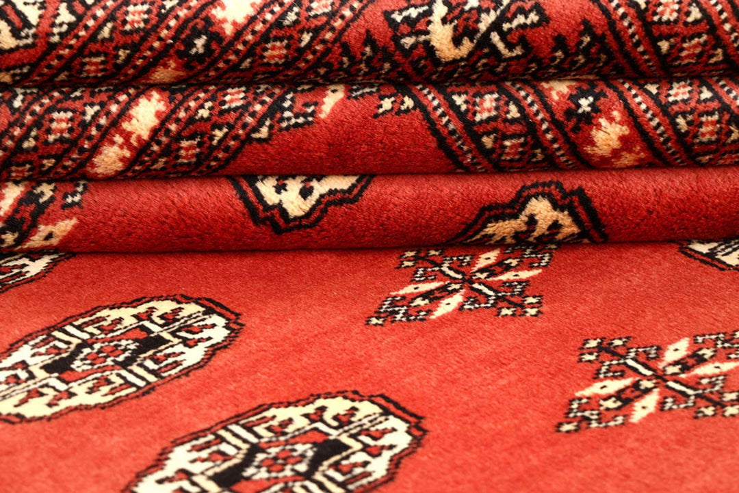 Coral Pakistani Bokhara Rug 6' 2" x 8' 10" Hand-Knotted | No. QA66791